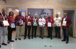  Kappa Alpha Psi Men holding books